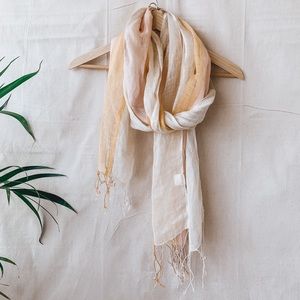 100% linen scarf with cream, pink & oranges.